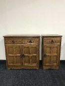 An oak double door cupboard and matching side cabinet