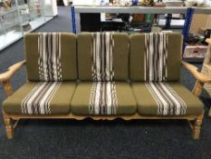 A three piece oak framed lounge suite in green