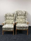 A pair of wing back armchairs in floral print