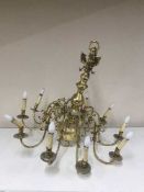 An impressive brass ten branch chandelier