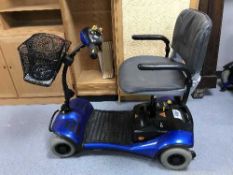 A Shop Rider disability cart with key and spare wheel
