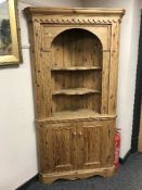 A Victorian style pine open corner display cabinet