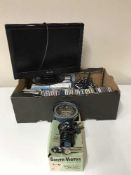 A box containing CD's, extension leads, LCD TV,