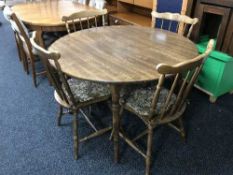 A circular Dinetta kitchen table and four chairs