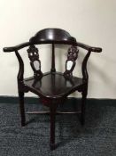 An oriental style corner armchair