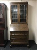 An oak leaded door bureau bookcase
