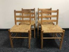 A set of seven pine rushed seated kitchen chairs