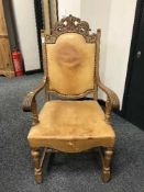 A carved oak armchair