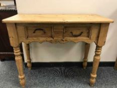 A Victorian style two drawer side table