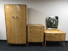 A three piece birds eye maple bedroom suite