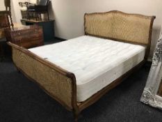 A 6' bergere bed frame and a Rest Assured Pocket Classic mattress