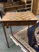 A 19th century inlaid walnut games table