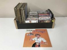 A box containing a quantity of assorted DVD's and LP's