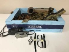 A box containing assorted cameras, brass ware,