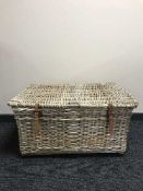 A large wicker laundry hamper