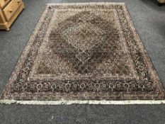 A fringed Persian Tabriz carpet with millefiori field,