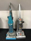 A Dyson DC 7 upright vac and a Vax vac cleaner