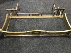 Two antique brass fire curbs