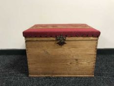 A stripped pine blanket box