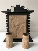 A Polish wall cabinet with pottery panel and two drinking vessels