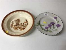 A pottery plate with Wemyss style painted decoration,