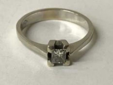 An 18ct white gold diamond solitaire ring, the diamond weighing 0.
