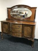 A mahogany mirror backed sideboard