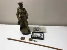 A good collection of militaria - buttons, badges, shell casing caps, swagger stick,