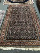 A fringed Persian Feraghan design rug,