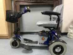 A Shop Rider disability cart with keys, charger,
