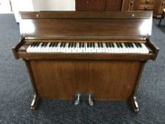 A mahogany cased mini piano by Evestaff