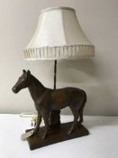 A pottery table lamp modelled as a horse