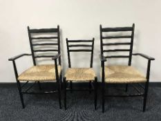 A pair of rush seated armchairs and a matching single chair