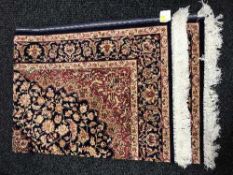 A fringed Persian Keshan rug,