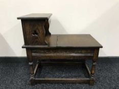 A Jaycee oak storage telephone table