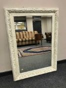A rectangular cream framed mirror