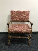 A late Victorian turned armchair in red fabric
