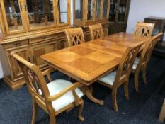 A colonial style dining table with two leaves and six chairs