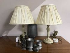 A brass fire fender, three table lamps, pewter goblet,