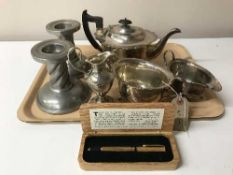 A three piece EPNS tea service and a boxed Theakstons pen,