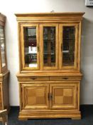 A colonial style double door display cabinet