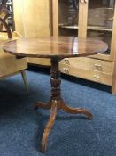 A Victorian pedestal occasional table