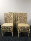 A set of four wicker Lloyd Loom dining chairs