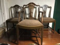 Seven mahogany Hepplewhite style dining chairs