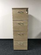 Four drawer wood effect filing cabinet with key