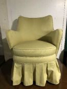 A mid 20th century armchair in gold fabric