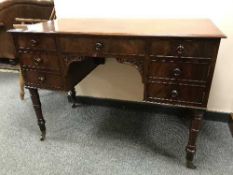 A Victorian mahogany knee hole dressing table