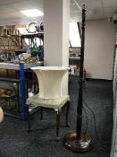 A walnut dressing table stool and standard lamp