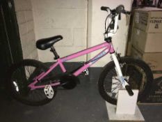 A girl's Diamond Back BMX with home made bike stand