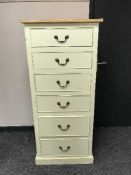 A painted six drawer chest with pine top